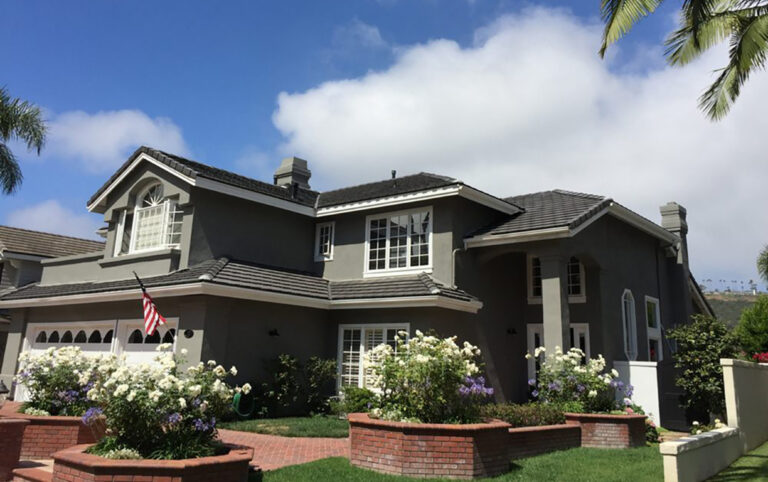 Re-roof and solar integration. Standard weight concrete tiles by Boral in English Thatch style colorway charcoal.