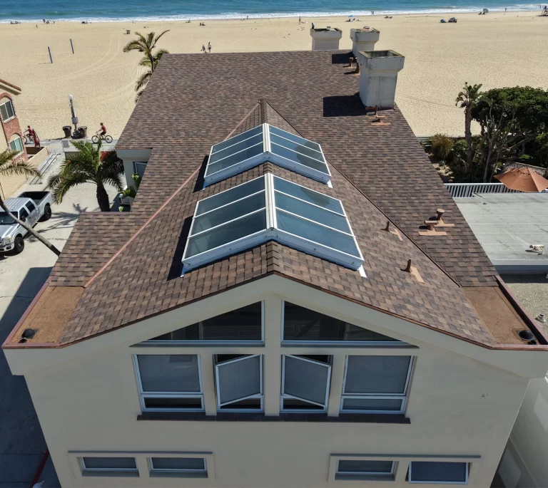 This Newport On The Peninsula roofing replacement features Landmark Pro shingles and white acrylic coating.